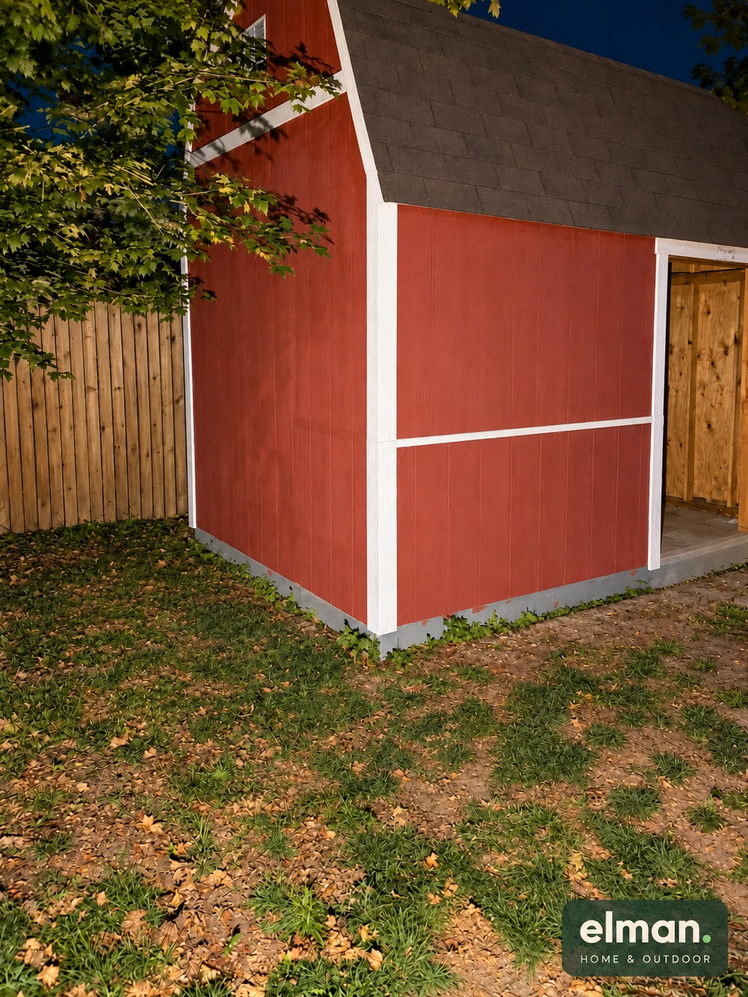 Completed shed exterior with red siding and white trim after wood replacement and painting